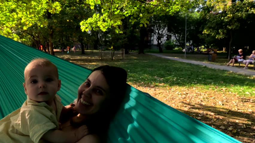 Mother and Baby Relaxing in a Hammock copy space