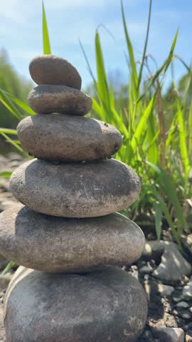 balance stones on the river in the spring zen spa 4k vertical