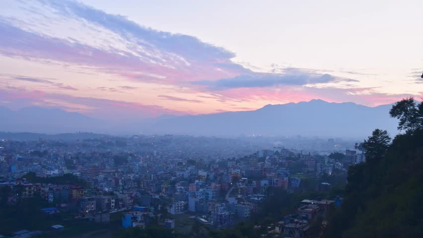 Beautiful 4k panorama sunset timelapse over Nepal capital Kathmandu city with colorful buildings from viewpoint with Himalayas mountains background