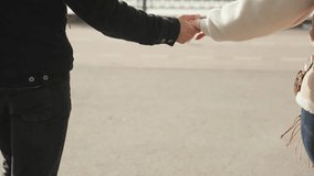 Happy couple in love, man and woman, holding hands and walking outdoors in winter. - Powered by Shutterstock - Get 15% off with code: PIKWIZARD15