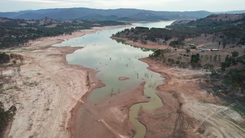 Reversing drone footage of the Burnt Creek inlet on Lake Eildon, near Mansfield in central Victoria, Australia. The storage was 61% full. April 2025.