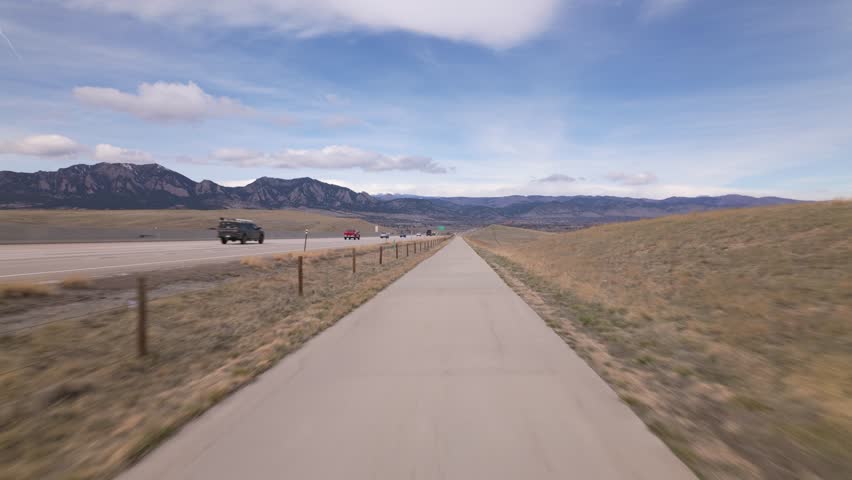 Scenic Mountain View From US 36 Bikeway Along Denver Boulder Turnpike In Denver, Colorado. wide shot