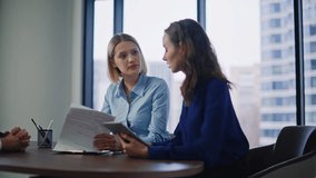 Bank clients signing deal after financial advisor consultation at modern panoramic office. Smiling woman putting signature on papers shaking man hand. Business partners enjoy successful agreement. - Powered by Shutterstock - Get 15% off with code: PIKWIZARD15