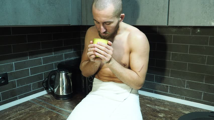 Young attractive man drinking coffee in the morning.