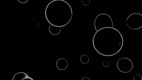 Abstract 3D horizontal animation loop flying bubbles black backgrounds sphere futuristic transparent liquid iridescent holographic prism shapes industrial oil petrol gasoline science biology molecules - Powered by Shutterstock - Get 15% off with code: PIKWIZARD15