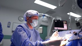 Neurosurgeon uses a surgical probe performing brain surgery. Doctor gives the device to the and applies the tool with a tube. - Powered by Shutterstock - Get 15% off with code: PIKWIZARD15