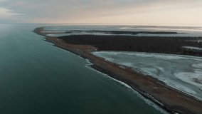 Desolate Landscape Of Sandbar Road And Wetlands In Notsuke Peninsula, Hokkaido, Japan. Aerial Drone Shot - Powered by Shutterstock - Get 15% off with code: PIKWIZARD15