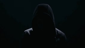 Enigmatic Figure Shrouded in Hooded Shadows - Powered by Shutterstock - Get 15% off with code: PIKWIZARD15