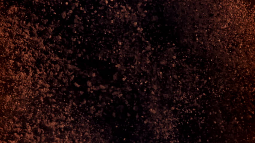 The cocoa powder flies up and down. Filmed on a high-speed camera at 1000 fps. High quality FullHD footage