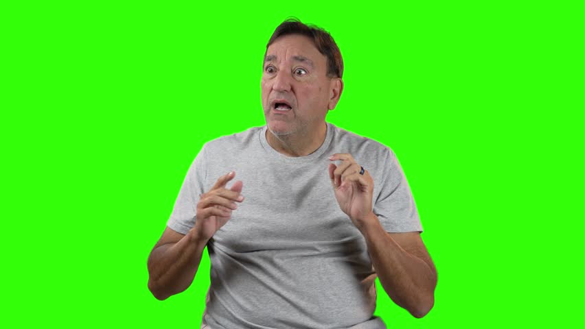 Man in gray t-shirt looks surprised and points offscreen with wide eyes and open mouth. Captured on green screen, ideal for creative edits and expressive reaction scenes.  	