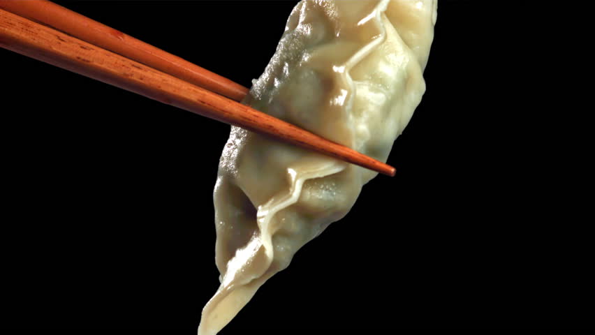Soy sauce is poured over the gyoze dumplings. Filmed on a high-speed camera at 1000 fps. High quality FullHD footage