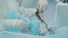 Surgeons performing laparoscopic surgery in operating room with precision instruments - Powered by Shutterstock - Get 15% off with code: PIKWIZARD15