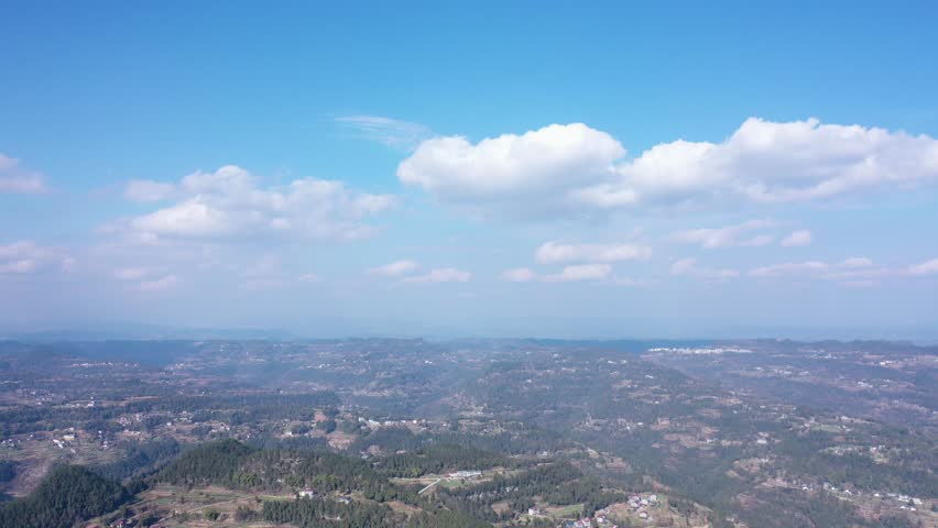 Aerial view of big mountain featuring blue sky and white clouds with dynamic timelapse effects over breathtaking landscape