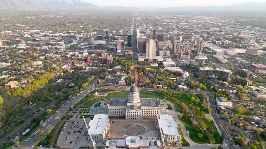 Moving drone shot of the Salt Lake City Capital building with the city scape in the background