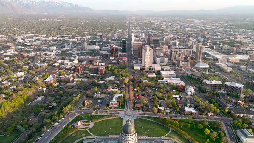 Moving drone shot of the Salt Lake City Capital building with the city scape in the background