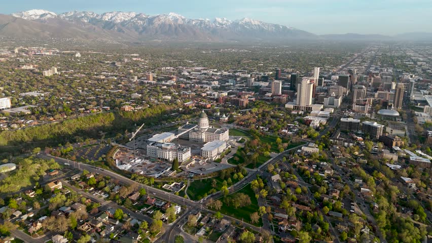 Moving drone shot of the Salt Lake City Capital building with the city scape in the background