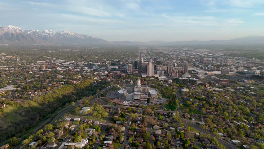 Moving drone shot of the Salt Lake City Capital building with the city scape in the background
