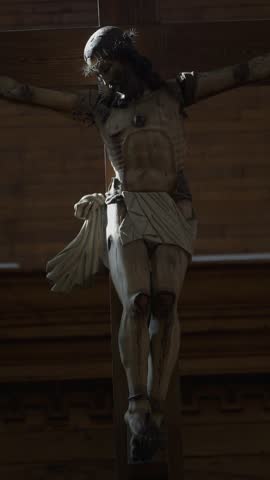 Wooden Church Interior with Crucifix and Warm Lighting