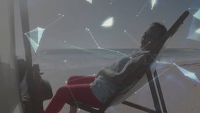 senior woman reclining on chair on beach, with holographic technology globe showing network lines. Outdoor, relaxation, technology, innovation, lifestyle, serenity, modern - Powered by Shutterstock - Get 15% off with code: PIKWIZARD15