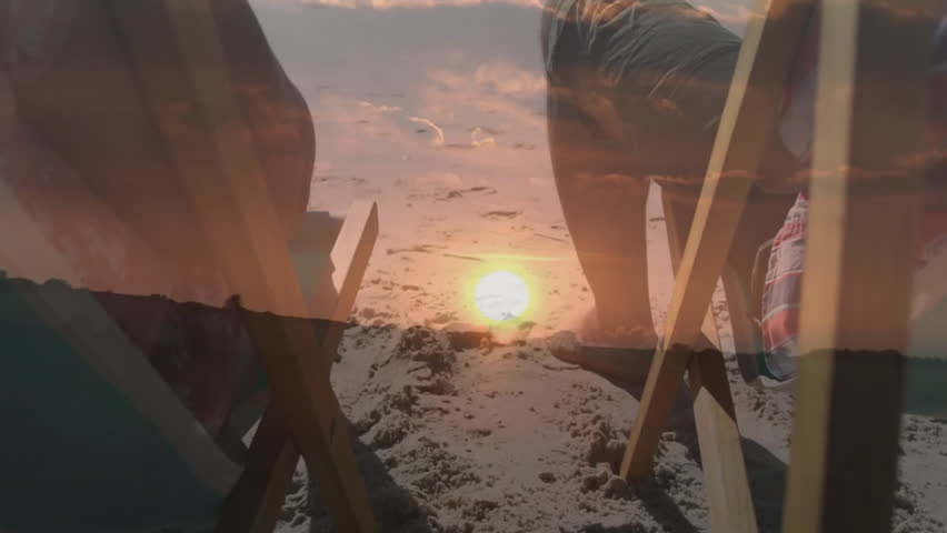 Couple holding hands on beach chairs at sunset, with animated health icon and glowing sun rays. Romance, intimacy, relaxation, scenic, peaceful, leisure, harmony