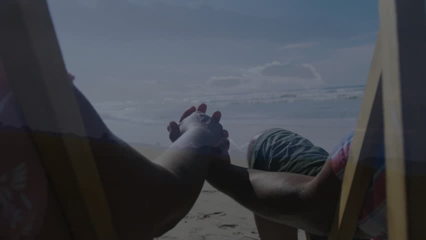 Couple holding hands on beach chairs at sunset, with animated health icon and glowing sun rays. Romance, intimacy, relaxation, scenic, peaceful, leisure, harmony
