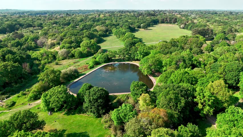 Nature Reserve Triangular Pond Landscape Aerial Drone Mid Angle Panning Down