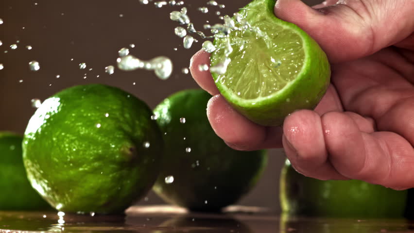 The chef squeezes lime juice. Filmed on a high-speed camera at 1000 fps. High quality FullHD footage