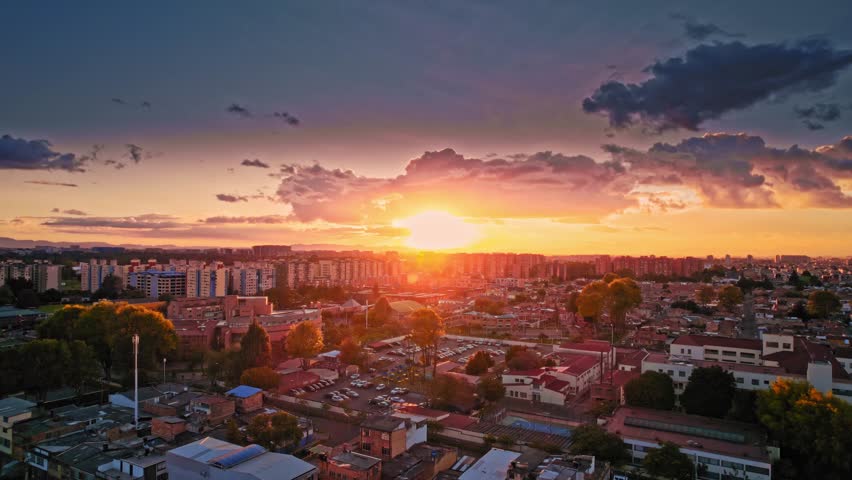 Urban Sunset with Dramatic Clouds and Rooftops - Bogotá, Colombia