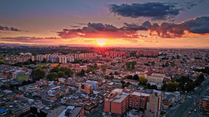Urban Sunset with Dramatic Clouds and Rooftops - Bogotá, Colombia