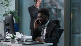 Busy multiethnic coworkers African American Caucasian men talking mobile phone cellphone multitask professional employees businessmen males business office colleagues teamwork consult call cooperate - Powered by Shutterstock - Get 15% off with code: PIKWIZARD15