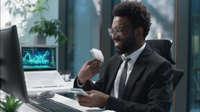 Happy African American man businessman counting money banknotes salary male enjoy guy count cash success business finances manager wealthy rich employee entrepreneur in office profit earn investment - Powered by Shutterstock - Get 15% off with code: PIKWIZARD15