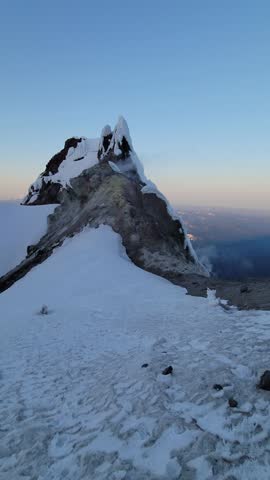 4K high resolution vertical mobile video of Mount Hood in Oregon, showcasing active volcanic fumaroles, rising gases, steam vents, Crater Rock, and Devil