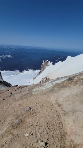 4K high resolution vertical mobile video of Mount Hood in Oregon, showcasing active volcanic fumaroles, rising gases, steam vents, Crater Rock, and Devil