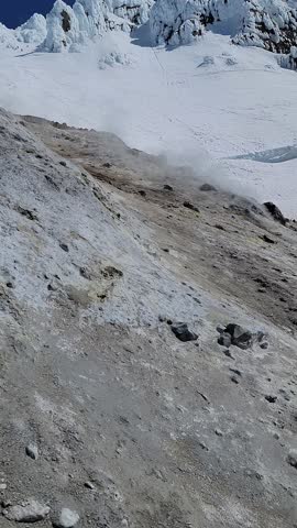 4K high resolution vertical mobile video of Mount Hood in Oregon, showcasing active volcanic fumaroles, rising gases, steam vents, Crater Rock, and Devil