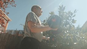 An elderly man engages in outdoor weight lifting under the sunlight, embracing health and fitness. - Powered by Shutterstock - Get 15% off with code: PIKWIZARD15