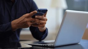 Male are using a mobile phone search information on the desk in the morning. - Powered by Shutterstock - Get 15% off with code: PIKWIZARD15