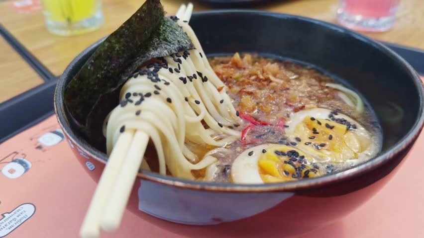 Asian ramen noodle soup. Japanese Ramen Noodles Beef or chicken. rice noodles fried meat,Tom Yam kung Spicy Thai asian soup. traditional korean food. Ramen Soup.Chinese Miso Soup. delicious ramen bowl