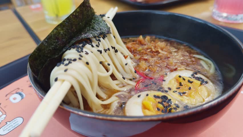 Asian ramen noodle soup. Japanese Ramen Noodles Beef or chicken. rice noodles fried meat,Tom Yam kung Spicy Thai asian soup. traditional korean food. Ramen Soup.Chinese Miso Soup. delicious ramen bowl