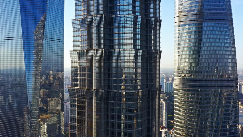 Aerial shot of modern city skyscrapers and glass wall buildings in Shanghai. Famous financial district buildings in China.