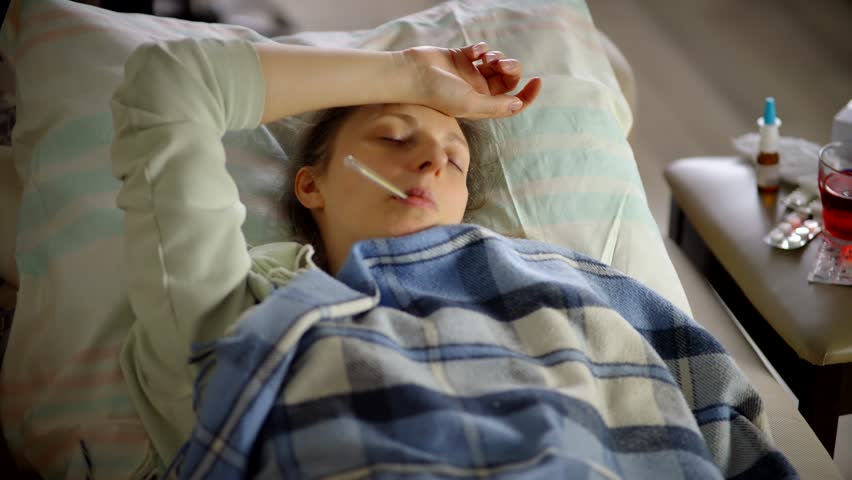 Sick Woman Fatigue High Temperature. Seasonal Cold Home Treatment. Unhealthy Sick Flu Virus Illness. Unwell Illness. Sick Woman Remedy Nasal Spray. Severe Cold  Suffering Flu ill Common Cold Symptoms