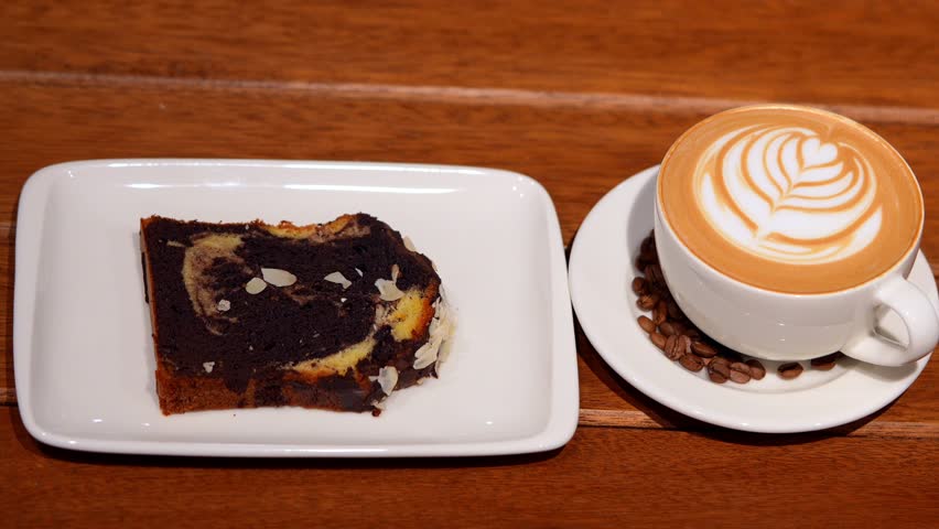 Marble Cake and Cappuccino Coffee Cup for Breakfast - 120fps Slow Motion 4K Footage - Powered by Shutterstock - Get 15% off with code: PIKWIZARD15