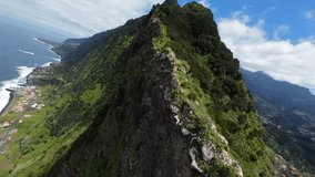 Fpv Drone ascending the ridges of a steep mountain in Sao Vicente, Madeira, Portugal. Reverse shot. Cinematic video - Powered by Shutterstock - Get 15% off with code: PIKWIZARD15