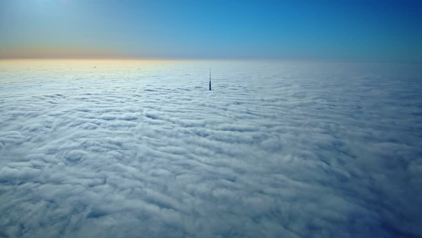 Stunning timelapse over Riga, Zakusala TV tower peeking through morning clouds