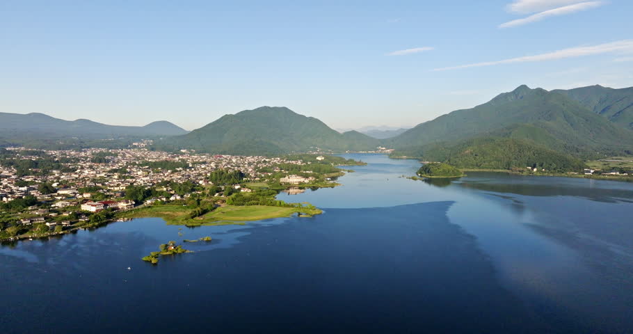 Drone flying over lake Kawaguchi, summer morning in Fujikawaguchiko, Japan