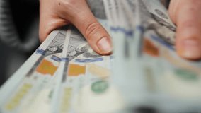 Woman counting US Dollar bills, close-up - Powered by Shutterstock - Get 15% off with code: PIKWIZARD15