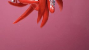 Glossy Fresh Chilies in Clean Water Composition - Powered by Shutterstock - Get 15% off with code: PIKWIZARD15