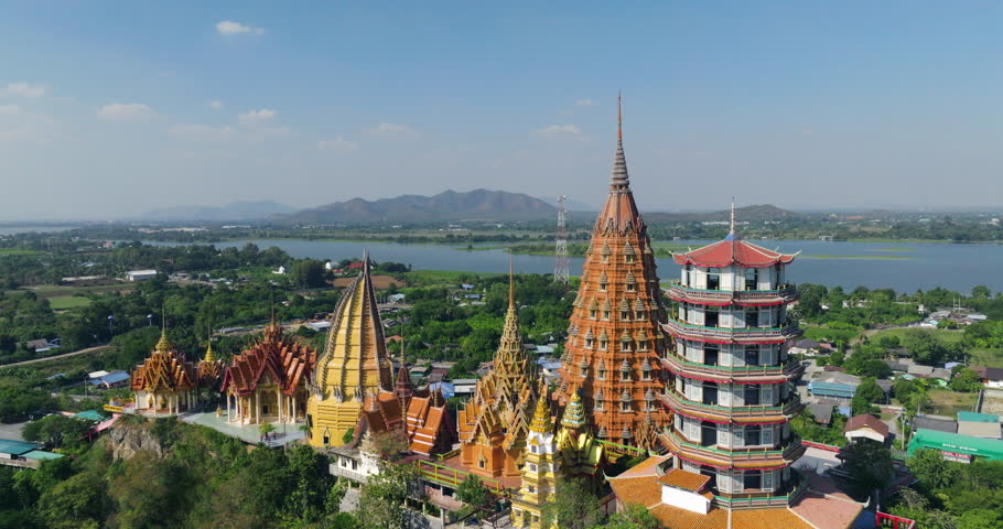 Chinese-style Temples At Wat Tham Suea With Mae Klong River In The Background In Kanchanaburi, Thailand. - aerial shot