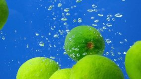 Fresh Limes Underwater. Burst of Citrus Bubbles Slow Motion - Powered by Shutterstock - Get 15% off with code: PIKWIZARD15