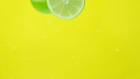 Halved Limes Underwater. Citrus Splash In Slow Motion - Powered by Shutterstock - Get 15% off with code: PIKWIZARD15