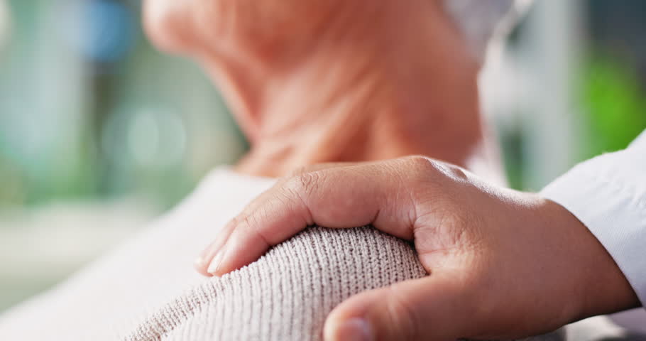 Doctor, elderly woman and holding hands for support of bad news, compassion and medical diagnosis. People, empathy and console patient for healthcare, wellness trust and helping with treatment advice